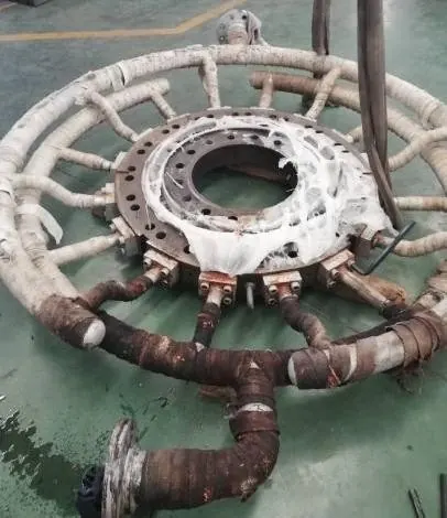 Worn die plate with heating assembly before reconditioning