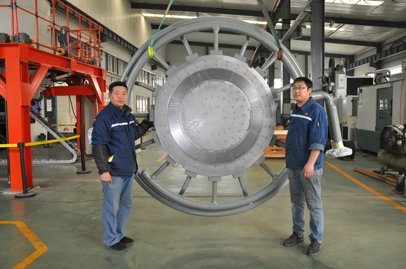 Large LLDPE pelletizing die plate for a 300,000 t/a line with two JINFENG engineers
